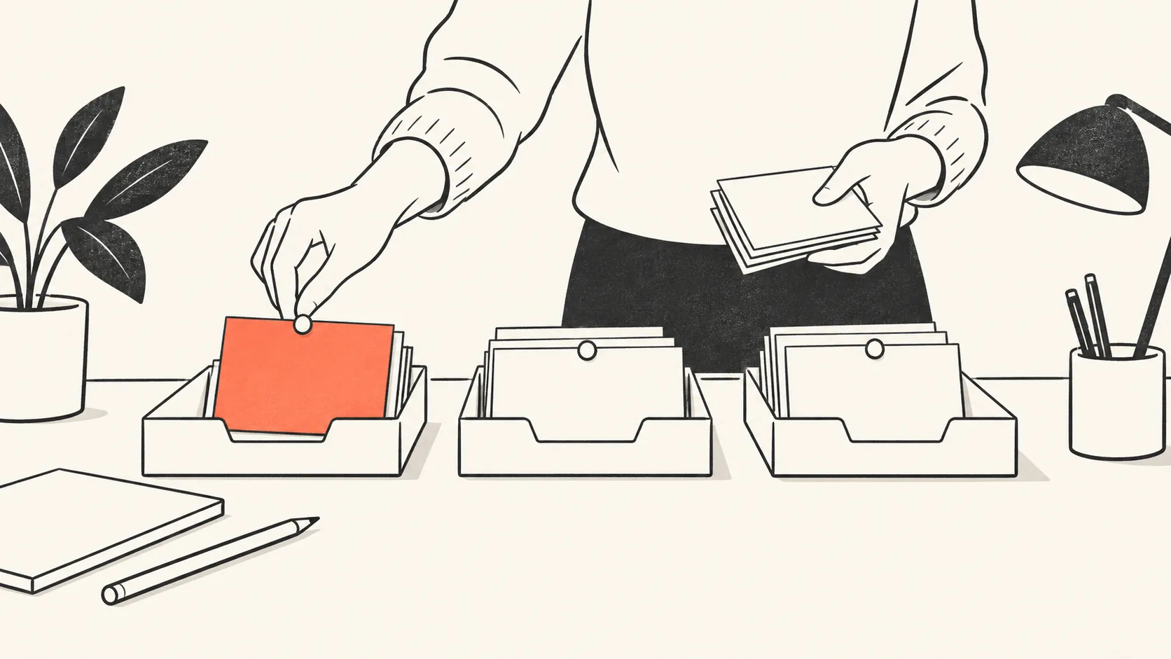 A hand sorting small paper cards into three trays, with one card pinned at the top of the first tray